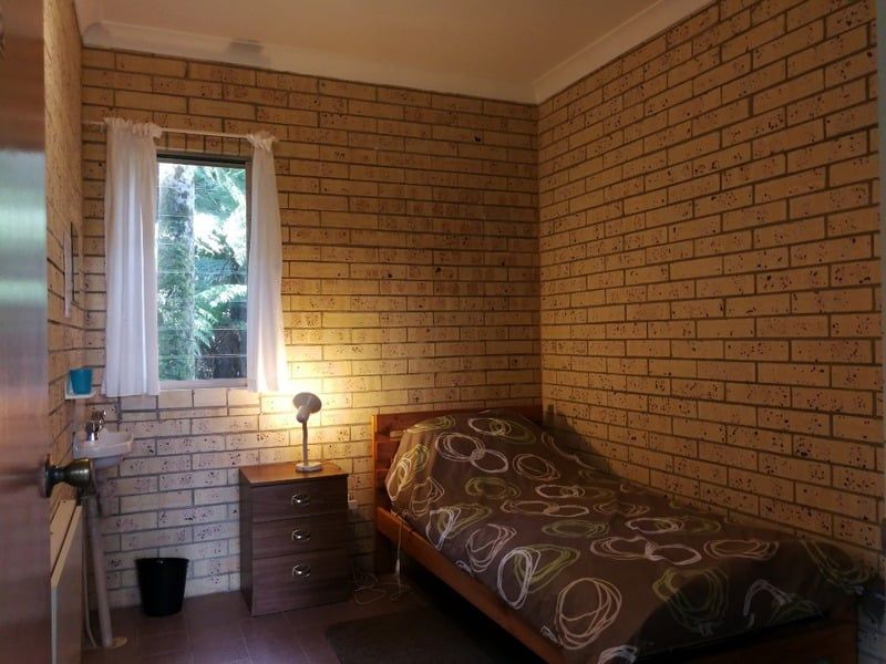Simple, comfortable retreat room with shared bathroom